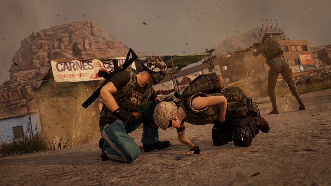 A PUBG player crouching over a downed teammate to revive them mid-firefight in a dusty urban environment — the exact teammate action PUBG Ally's AI is being trained to perform autonomously