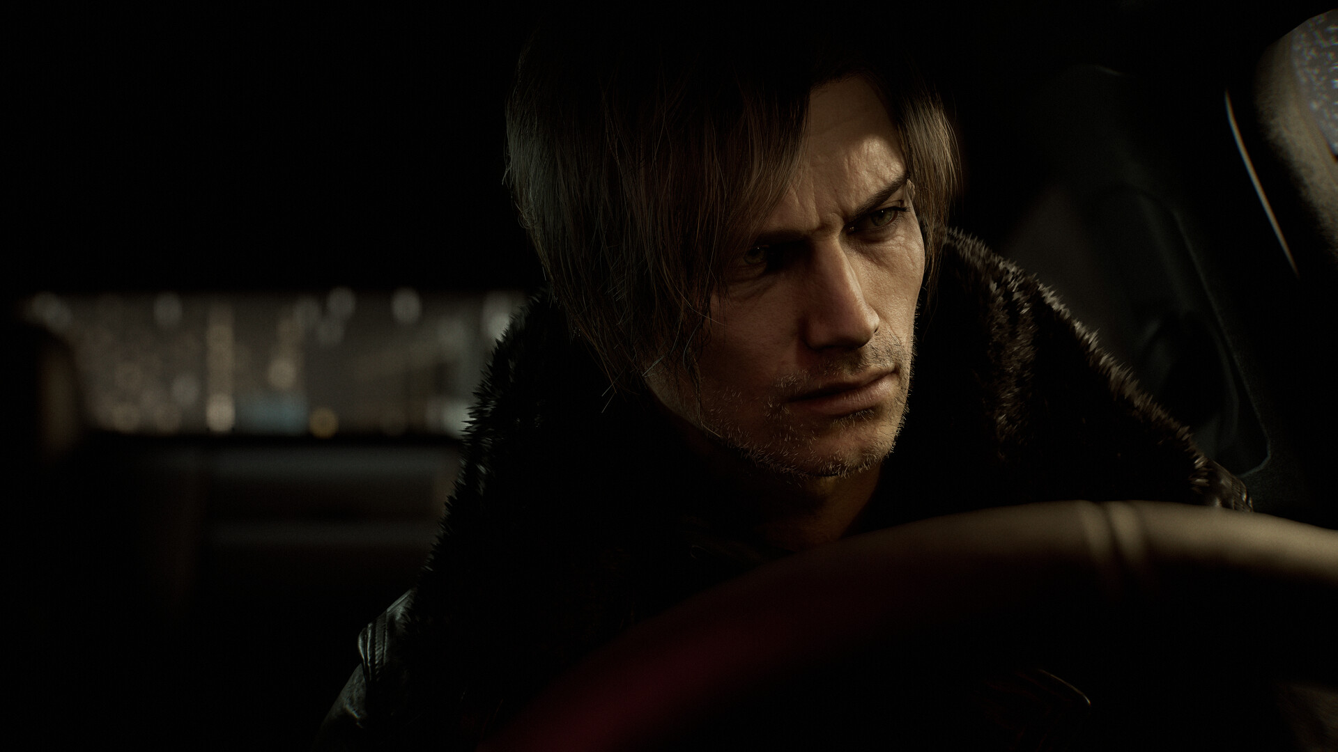 Leon Kennedy stares intensely from behind the wheel, his weathered face lit by city lights in the background